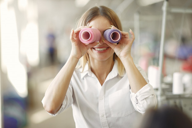 woman-standing-factory-with-thread_1157-29351.jpg
